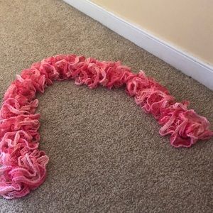 Handmade pink crocheted scarf.